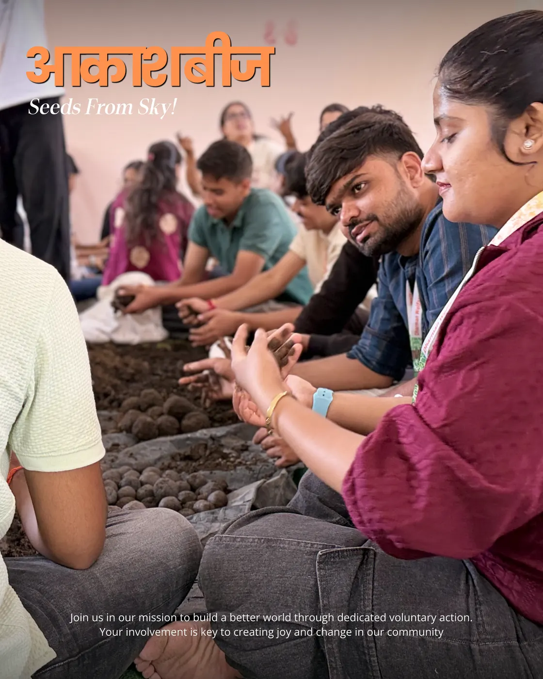 Students seated on the floor shaping seed balls from soil and compost.