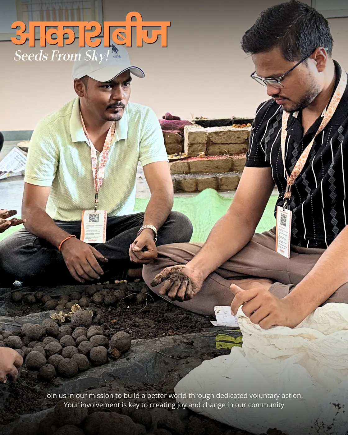 Two volunteers demonstrating how to pack a seed ball.