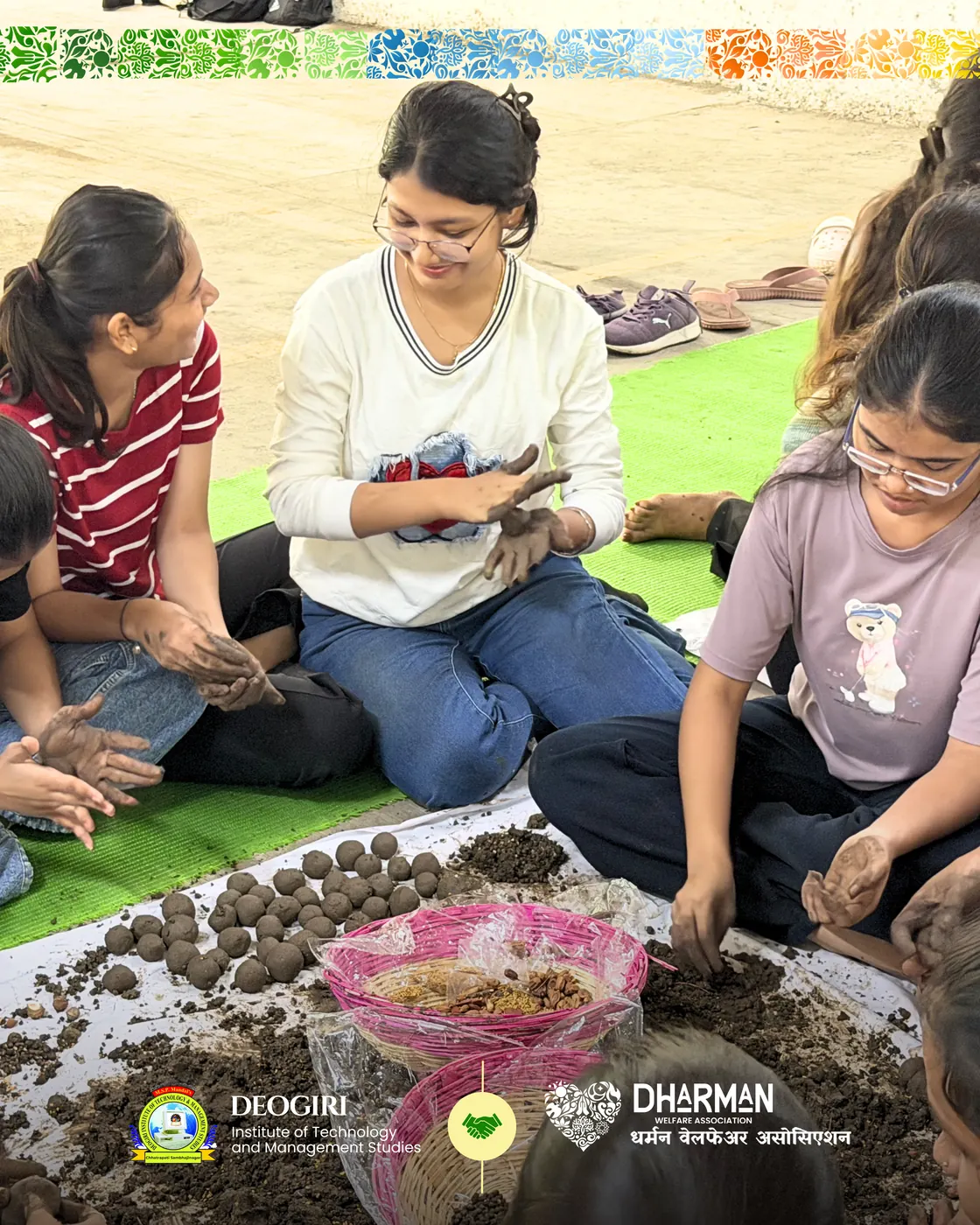 Students at the workshop with trays of completed seed balls.