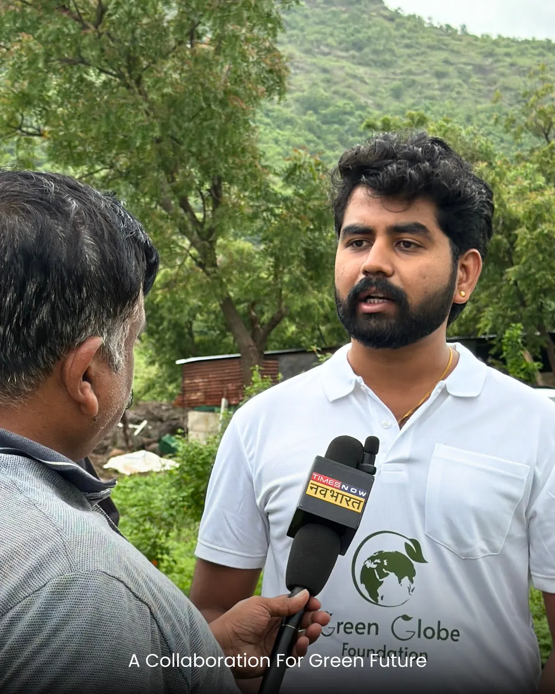 A Dharman volunteer being interviewed on camera at the dispersal site.