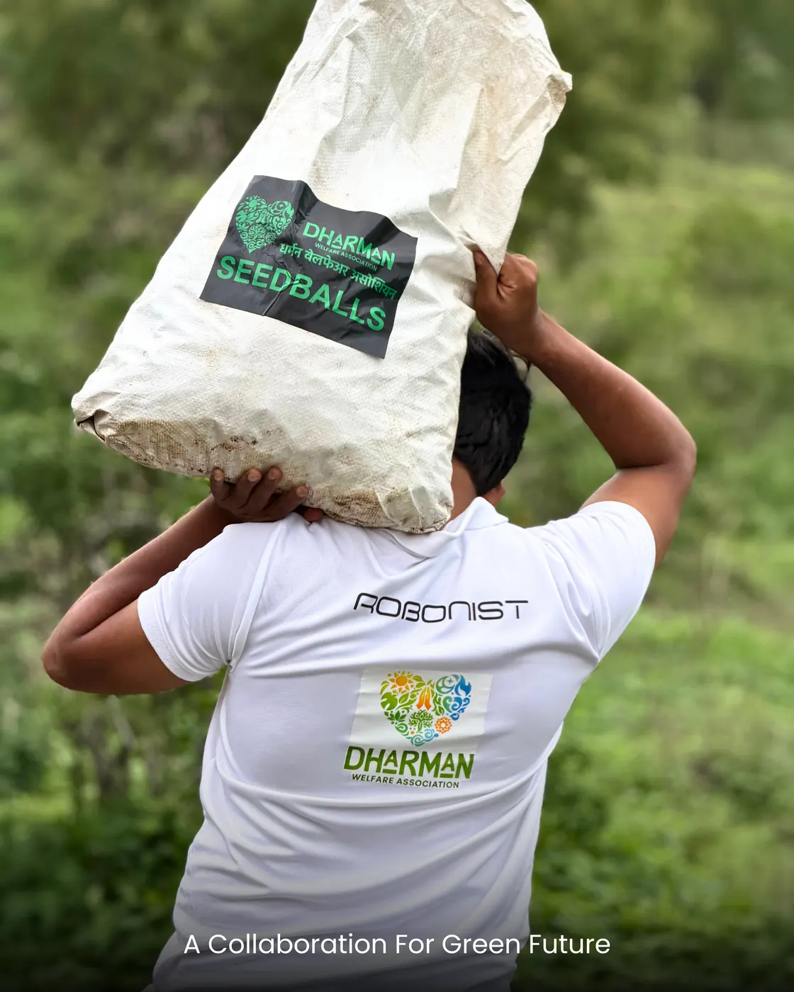 A volunteer carrying a sack of seed balls on their shoulder.