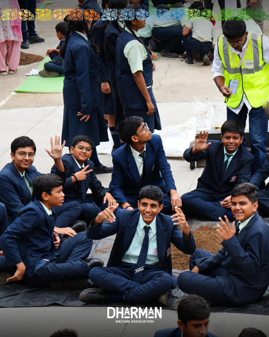 A school assembly ground filled with students making seed balls.