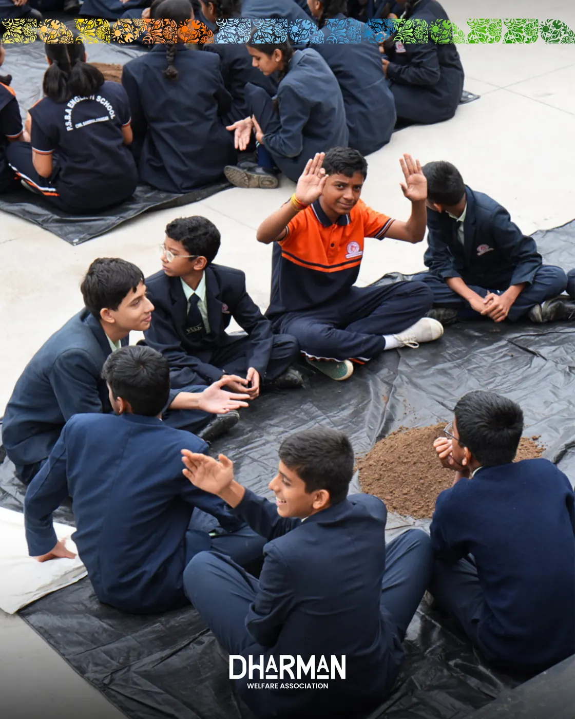 Younger students seated in rows working with soil and seeds.