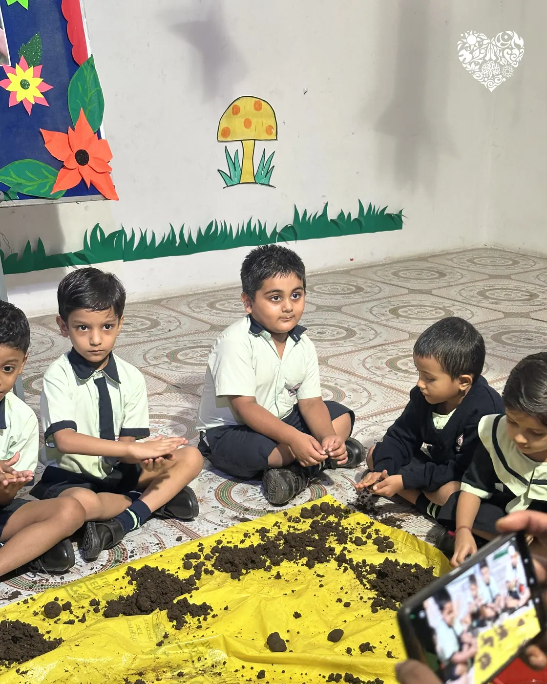 Pre-primary children seated together at the end of the session.
